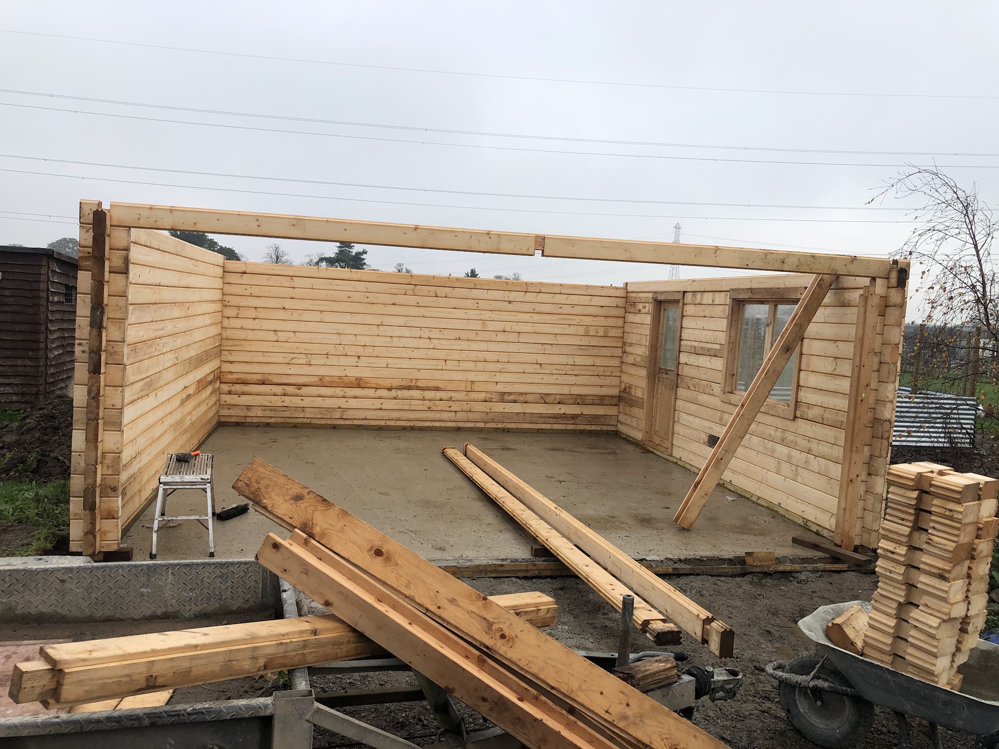 Timber garden room frame going up on a new concrete base